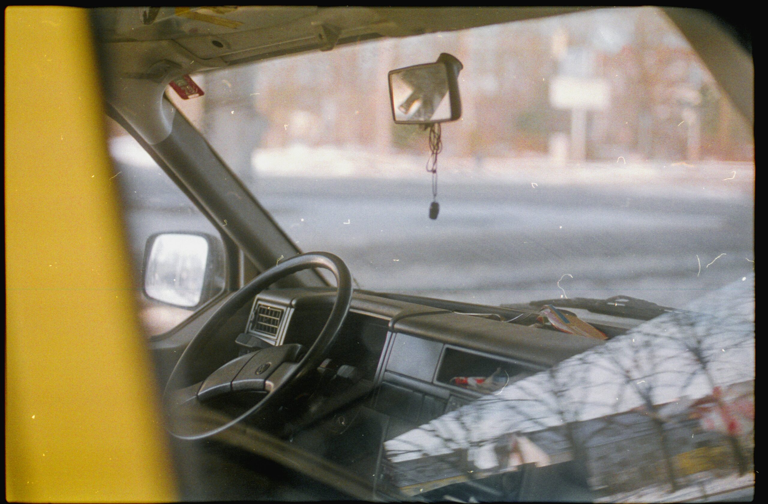 car on road during daytime windshield repair guide image